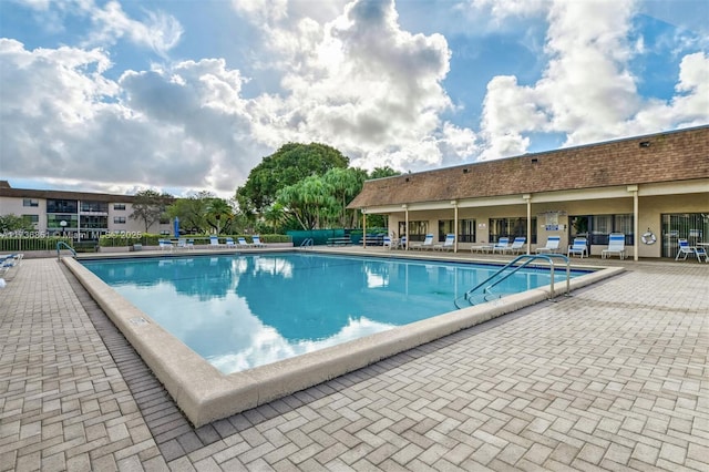 view of swimming pool featuring a patio area