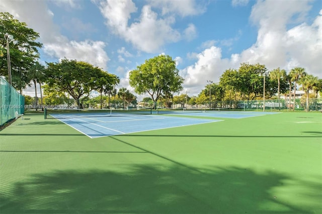 view of sport court with fence