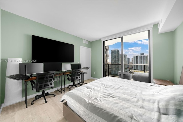 bedroom with light wood-type flooring