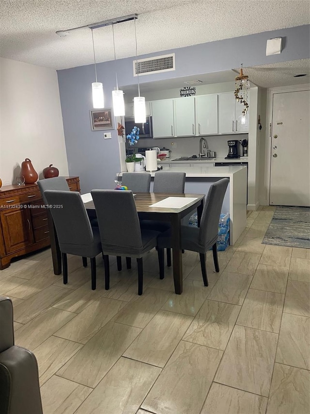 dining area with a textured ceiling