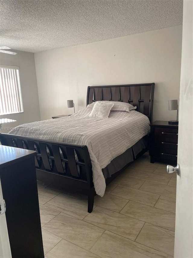 bedroom featuring a textured ceiling