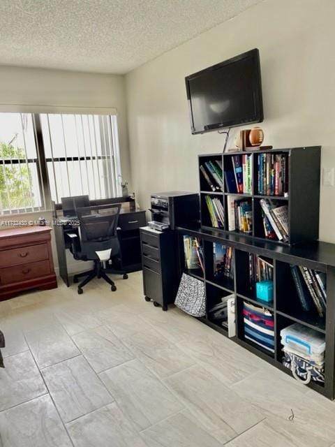 office area with a textured ceiling