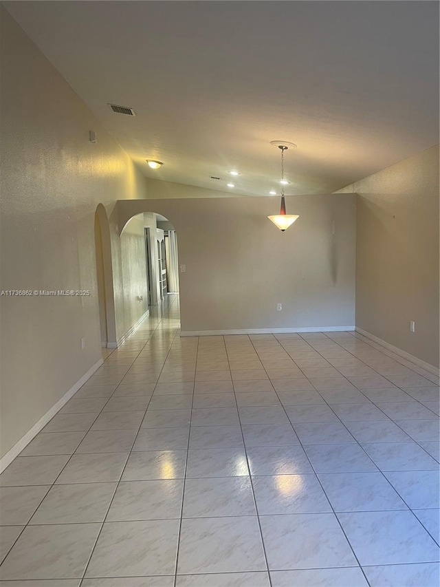 unfurnished room featuring light tile patterned flooring