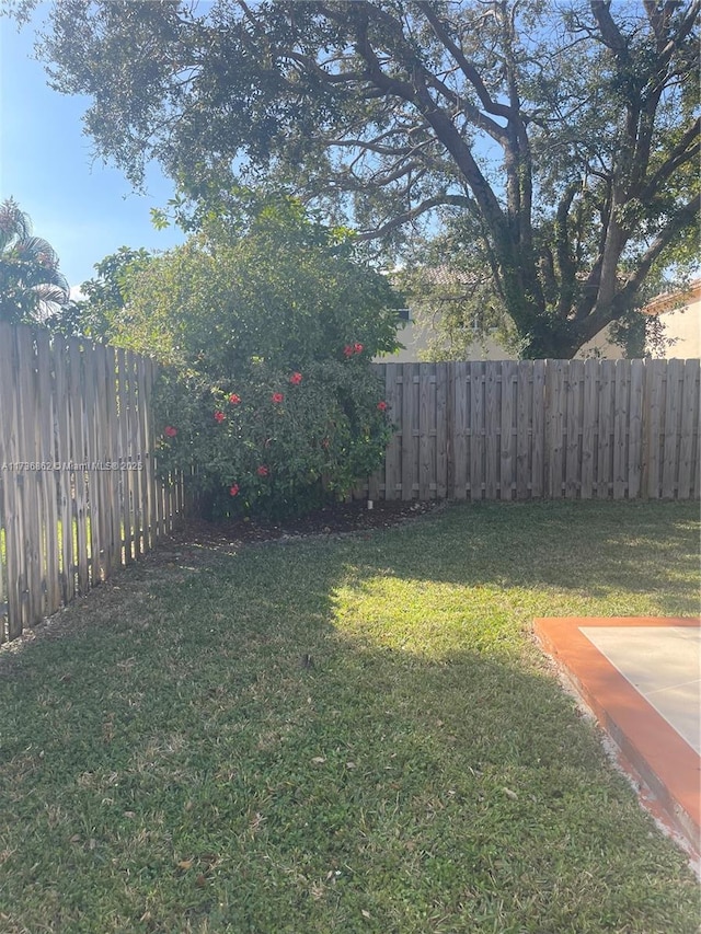 view of yard with a fenced backyard