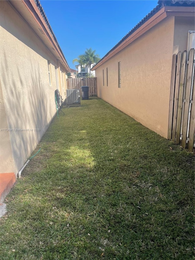 view of yard with central AC