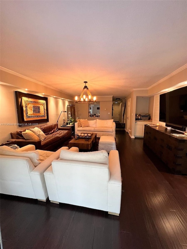 living room featuring crown molding, a chandelier, and dark hardwood / wood-style flooring