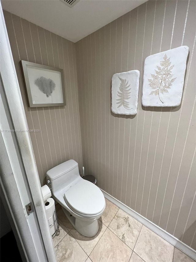 bathroom featuring tile patterned floors and toilet