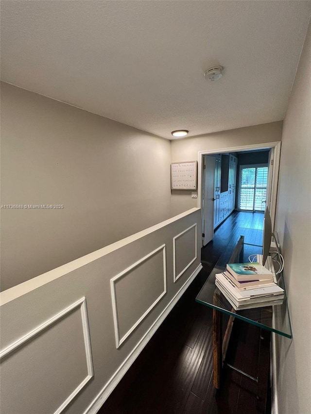 hallway with dark wood-type flooring