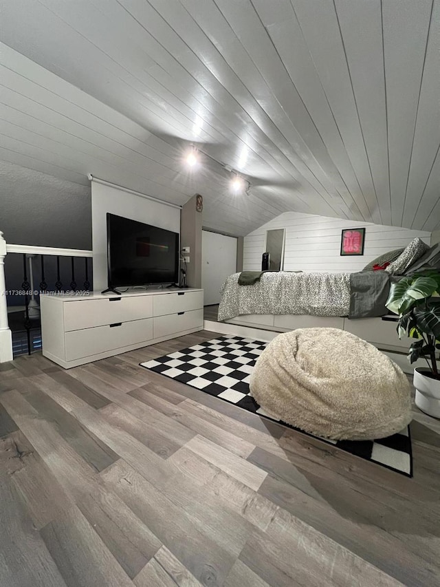 interior space with vaulted ceiling, hardwood / wood-style floors, and wood ceiling