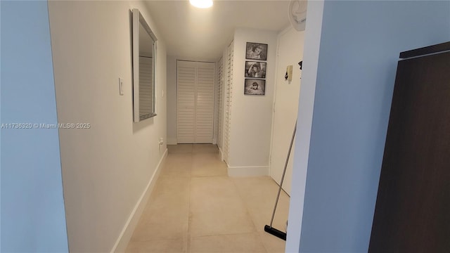 corridor with light tile patterned floors