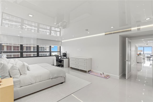 bedroom featuring a high ceiling