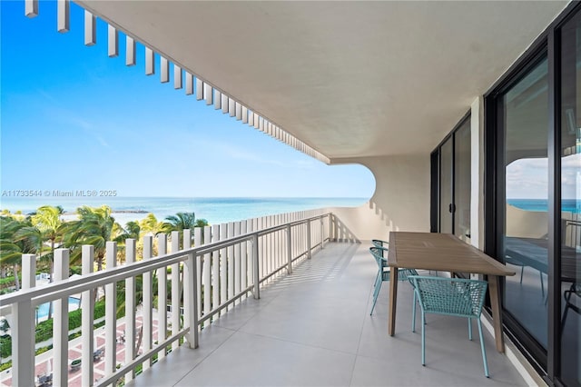 balcony featuring a water view