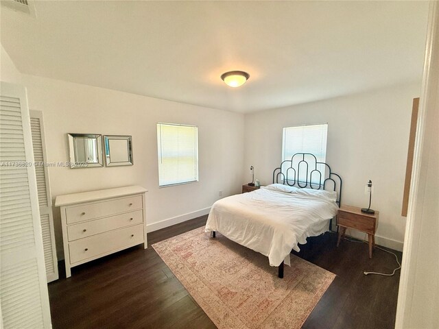 bedroom featuring dark hardwood / wood-style floors