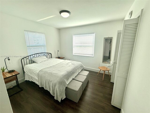 bedroom featuring dark wood-type flooring