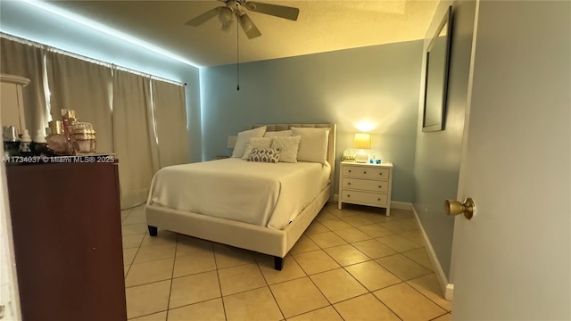 bedroom with light tile patterned flooring and ceiling fan