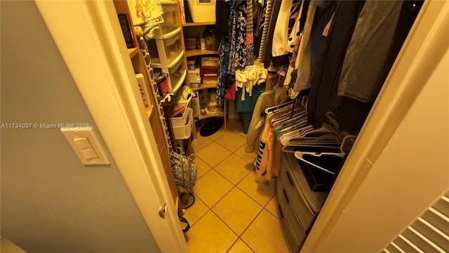 spacious closet featuring light tile patterned flooring