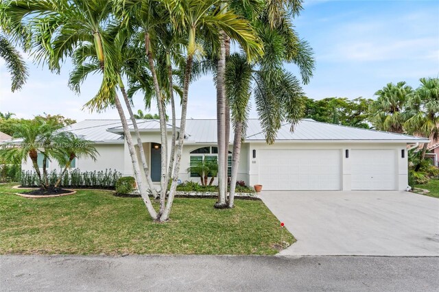 single story home with a garage and a front yard