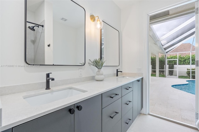 full bath featuring vaulted ceiling, a sink, and double vanity