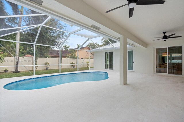 view of swimming pool featuring a lanai, a patio, and ceiling fan