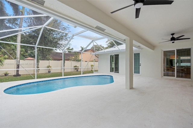 view of pool with a fenced in pool, a patio, a fenced backyard, ceiling fan, and a lanai