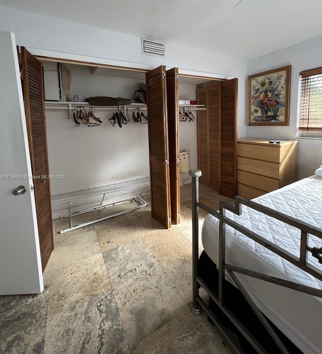 bedroom with multiple closets