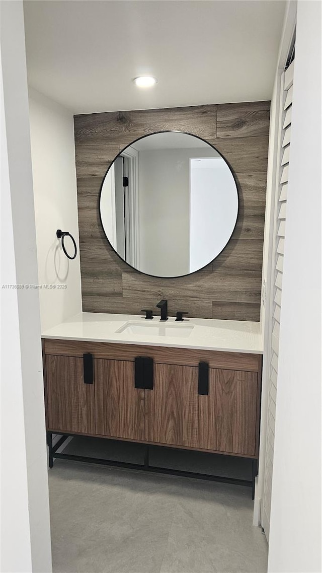 bathroom with vanity and concrete floors