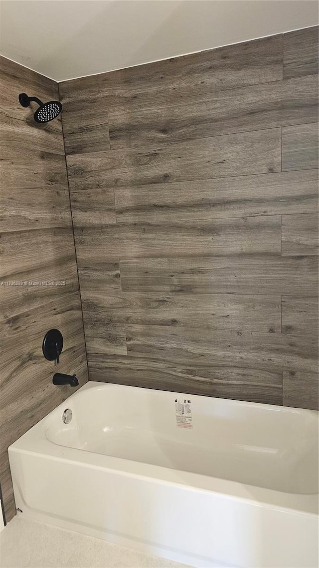 bathroom with shower / tub combination