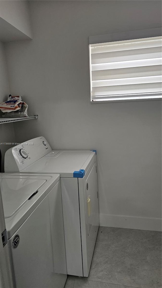 washroom featuring independent washer and dryer