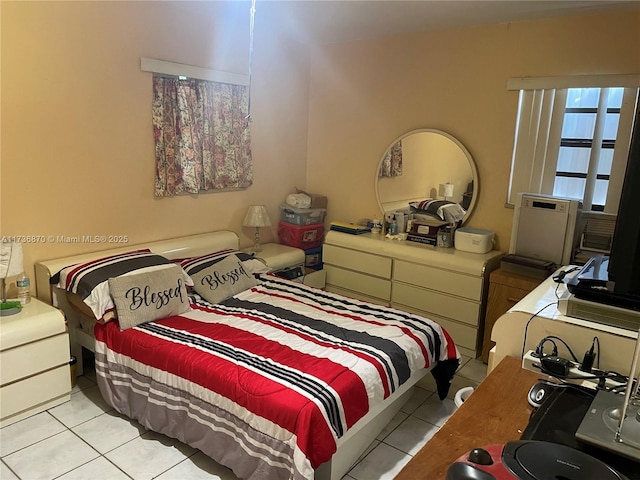 bedroom with light tile patterned floors