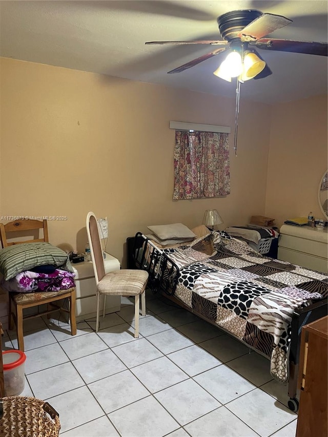 tiled bedroom with ceiling fan