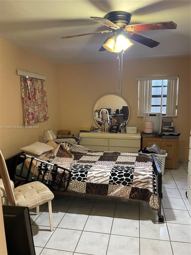 bedroom with light tile patterned flooring and ceiling fan