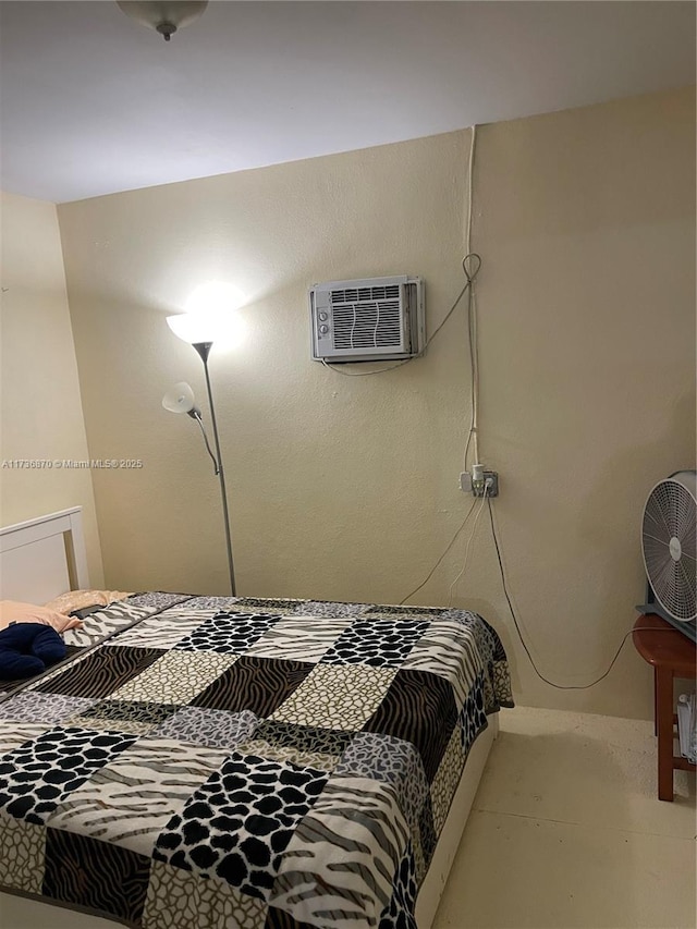 bedroom featuring a wall unit AC