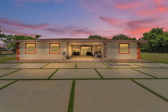 back of house featuring stucco siding