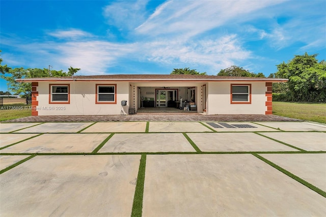 back of house featuring stucco siding