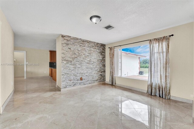 15750 SW 232nd St, Miami, FL 33170 - unfurnished room with a textured ceiling and baseboards