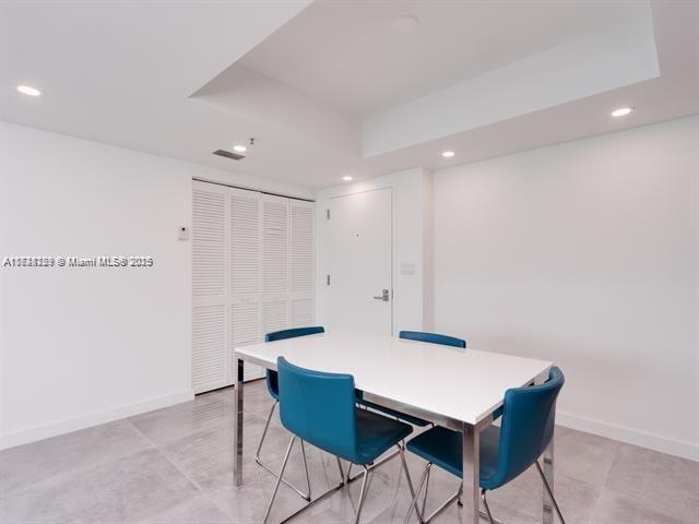 dining room featuring a raised ceiling