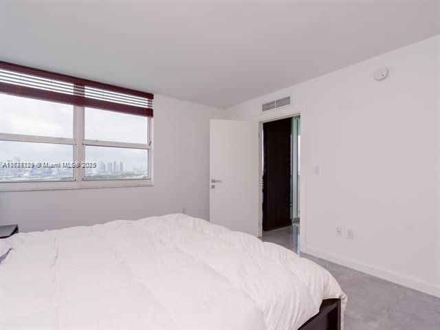 bedroom with light colored carpet