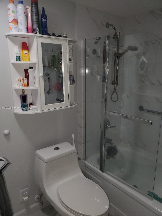 bathroom with enclosed tub / shower combo and toilet