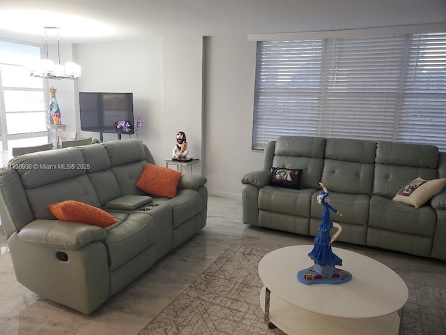 living room featuring a notable chandelier