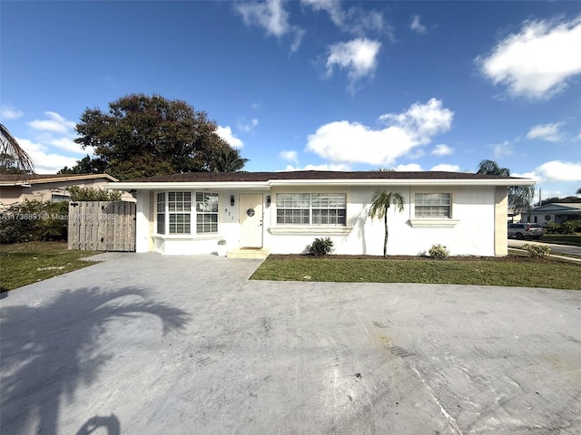 ranch-style house with a front yard