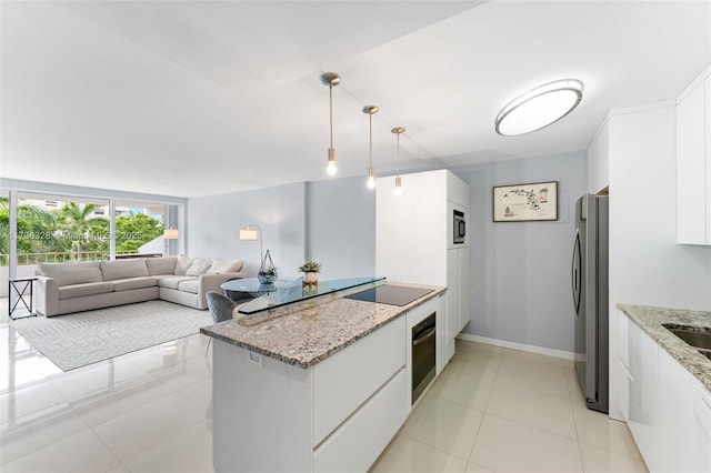 155 Ocean Lane Dr Unit 407, Key Biscayne, FL 33149 - kitchen featuring freestanding refrigerator, wall oven, black electric cooktop, white cabinets, and light tile patterned floors