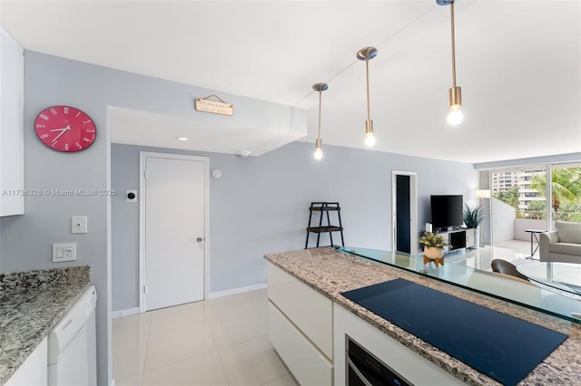 155 Ocean Lane Dr Unit 407, Key Biscayne, FL 33149 - kitchen featuring white dishwasher, black electric cooktop, white cabinets, decorative light fixtures, and baseboards