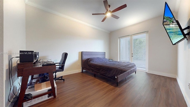 bedroom featuring hardwood / wood-style flooring, crown molding, vaulted ceiling, and access to outside