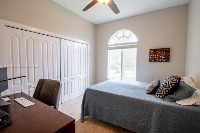 bedroom featuring ceiling fan, a closet, and light carpet