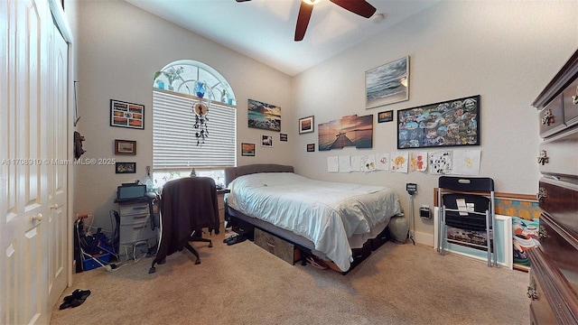 carpeted bedroom with lofted ceiling and ceiling fan