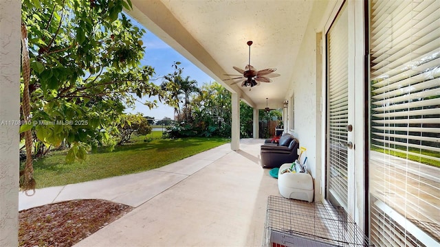 view of patio featuring ceiling fan