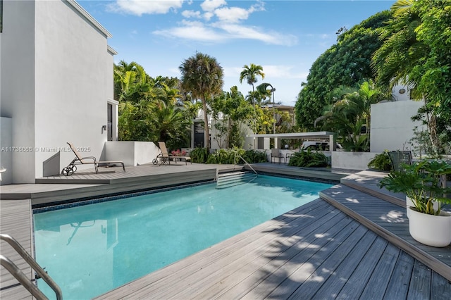 view of swimming pool featuring a deck