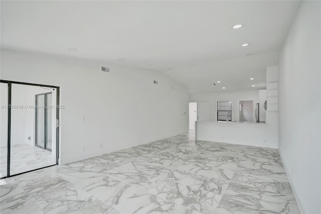 unfurnished living room with lofted ceiling, marble finish floor, visible vents, and recessed lighting