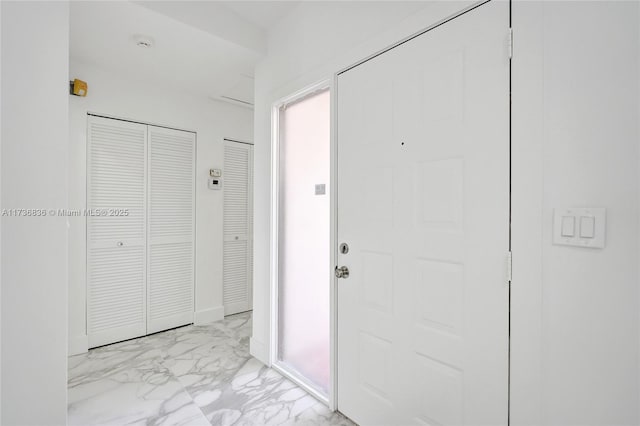 foyer entrance with marble finish floor