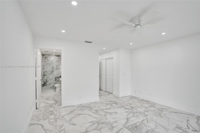 unfurnished bedroom featuring marble finish floor, a closet, visible vents, and recessed lighting